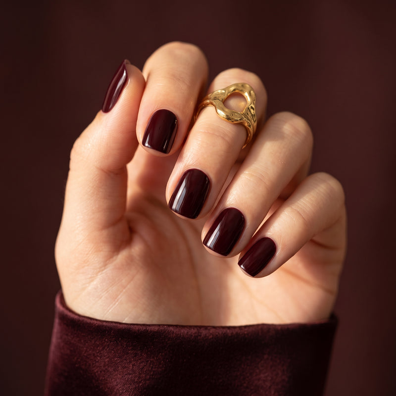 Deep burgundy glossy semi-cured gel nail wraps on short square nails