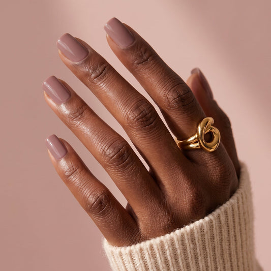 Mauve-pink glossy semi-cured gel nail wraps in a solid, glossy finish on short square nails.