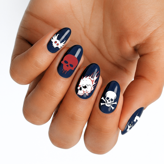 Black nail wraps with white skull and crossbones gothic design on hand