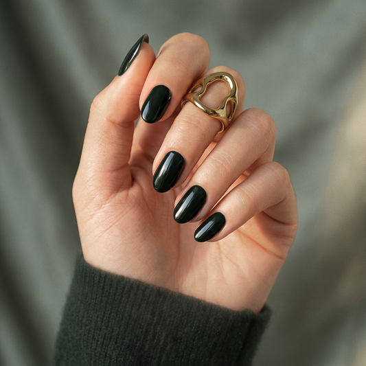 Dark forest green glossy semi-cured gel nail wraps in a glossy almond shape