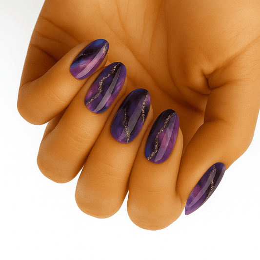 Purple amethyst marble nail wraps on hand showing glossy stone-effect manicure design