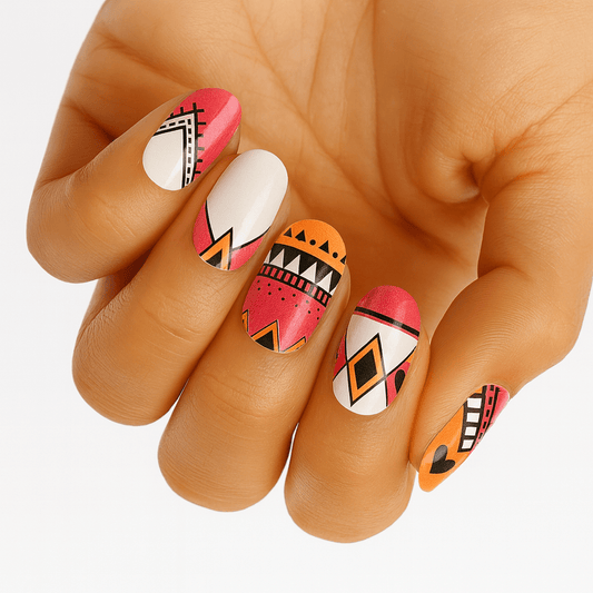 Geometric tribal pattern nail wraps on hand featuring pink orange white designs