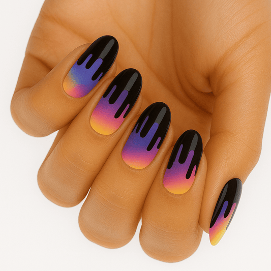 Purple to orange ombre gel nail wraps with black drip design on hand manicure