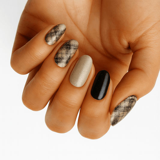 Boucle patterned nail wraps on hand showing black white and nude geometric design