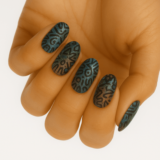 Dark green paisley pattern nail wraps on hand showing intricate swirl design