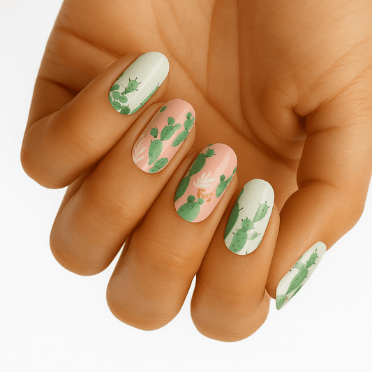 Green cactus pattern nail wraps on hand showing botanical nail art design