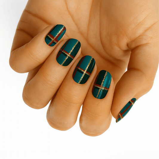 Teal tartan nail wraps with gold metallic stripes on hand showcasing Scottish plaid design