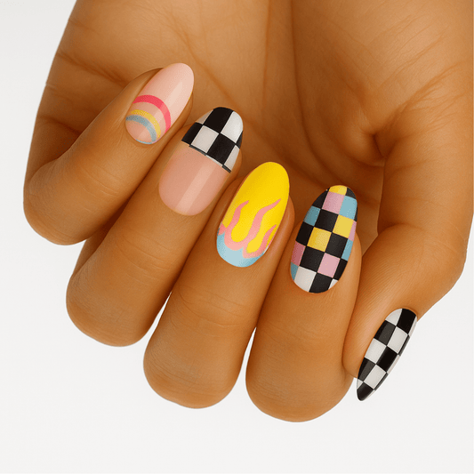 Colourful retro nail art on hand featuring chequered flag and rainbow designs