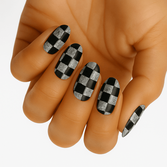 Black and silver chequered pattern non-UV nail wraps applied on hand showing geometric nail art
