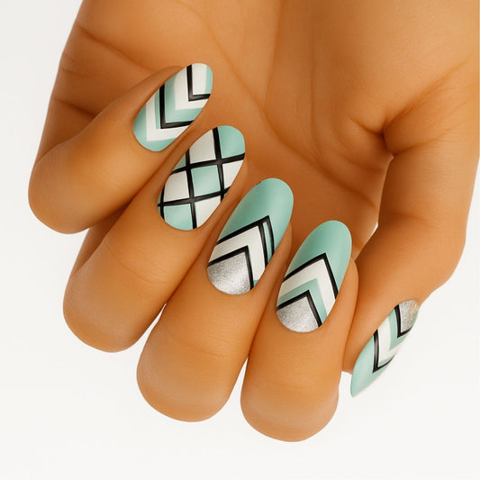 Mint green and white chevron pattern nail wraps on hand geometric design