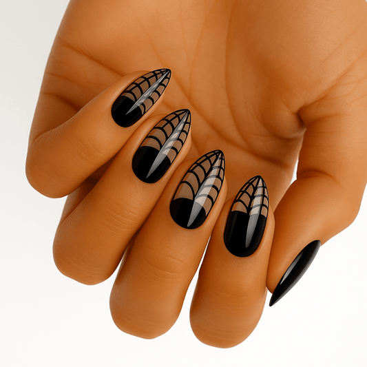 Black gothic nail wraps with white spider web pattern on hand showing Halloween nail art
