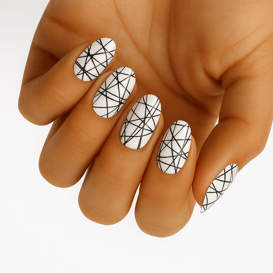 White gel nail wraps with black geometric line pattern on hand
