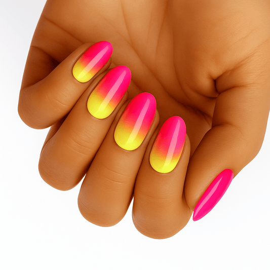 Pink to yellow ombre gel nail wraps on hand showing neon gradient manicure