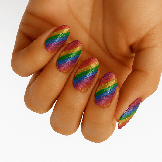 Rainbow glitter nail wraps on hand showing diagonal pride stripes with sparkle finish