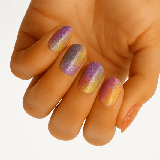 Purple pink gold iridescent ombre nail wraps on hand showing holographic shimmer gradient finish