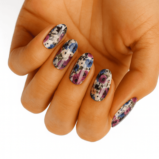 Pink purple watercolour floral nail wraps on hand showing botanical garden manicure design