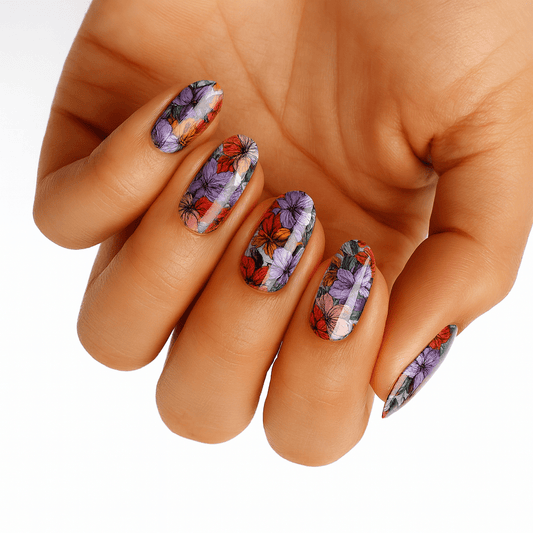 Purple and coral floral non-UV nail wraps with vintage botanical illustration designs on hand