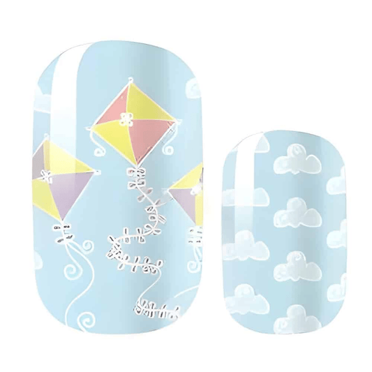 Blue nail wraps with colourful kites and white clouds pattern for spring manicure