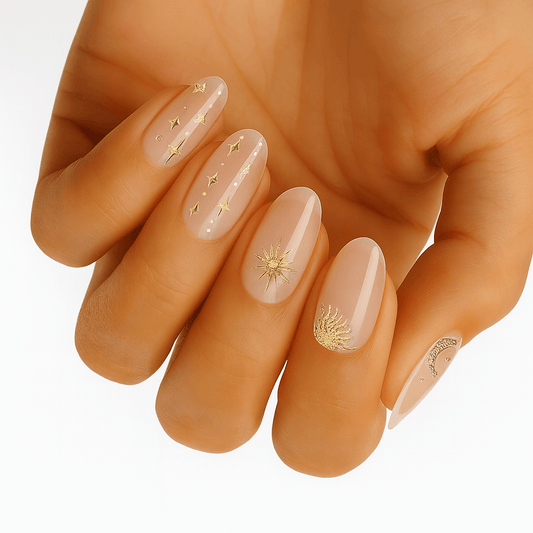 Nude gel nail wraps with gold celestial star designs on hand manicure