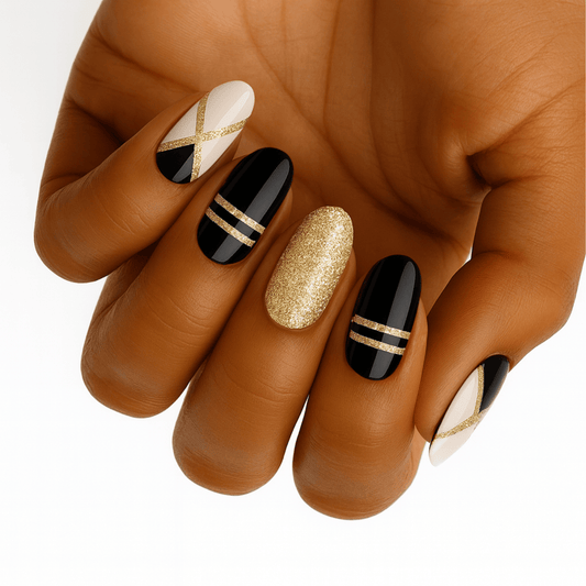 Black gold and white art deco nail wraps on hand showing geometric Gatsby patterns