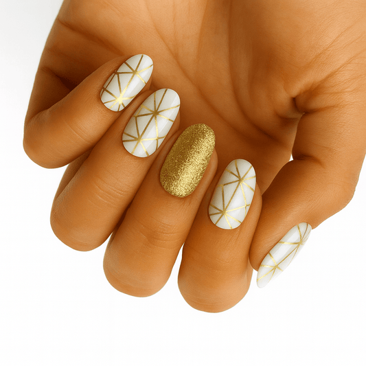 White nail wraps with gold geometric star pattern and glitter accent nail