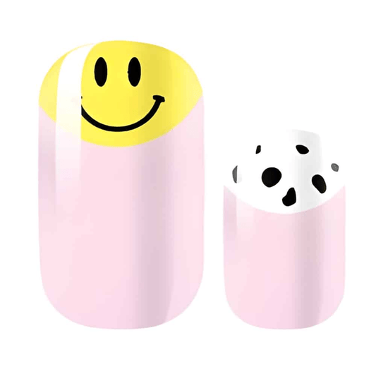 Non-UV nail wraps featuring yellow smiley face and black spotted patterns on pink