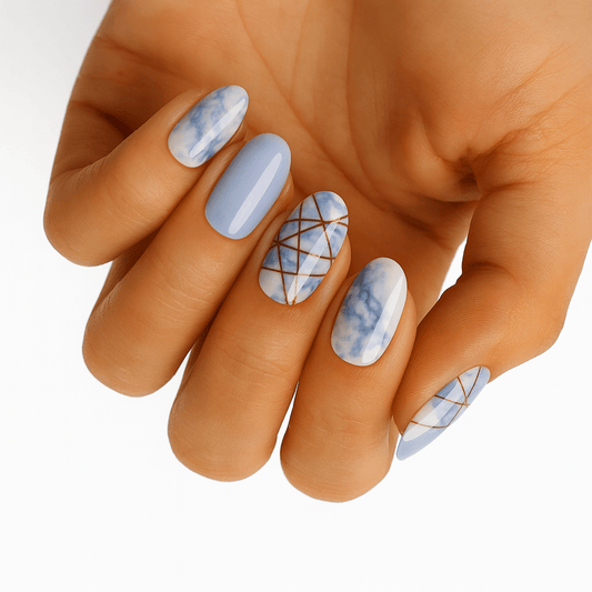 Blue marble geometric nail wraps with white stone effect on hand