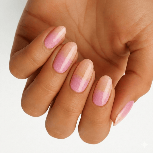 Pink ombre sunset nail wraps on hands showing glossy gradient manicure finish