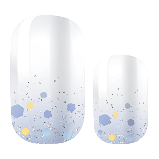 Ice blue nail wraps with hexagonal glitter confetti pattern and gradient finish