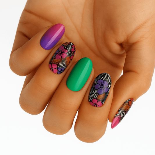 Colourful geometric nail art on hand featuring purple green orange pink nail wraps with tropical patterns