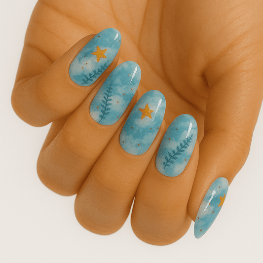 Blue botanical nail wraps with floral pattern on hand showing spring manicure design