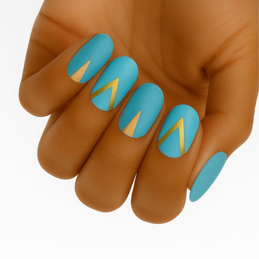 Teal matte nail wraps with gold geometric triangle patterns for at-home manicure