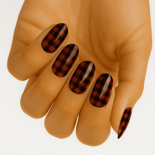 Red and black buffalo plaid nail wraps on hand showing lumberjack check pattern design