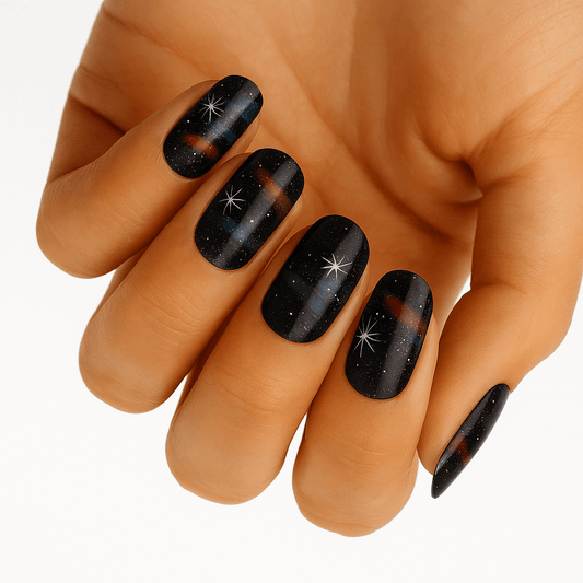 Black crackle effect nail wraps with silver stars and glitter on hand