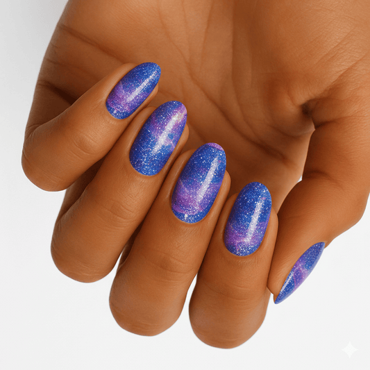 Blue purple magnetic chrome nail wraps on hand showing colour-changing shimmer finish