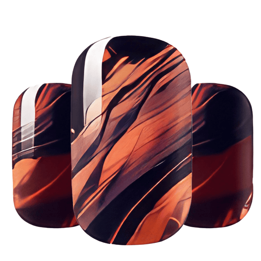 Abstract marble nail wraps in orange burgundy black flowing design for autumn manicure