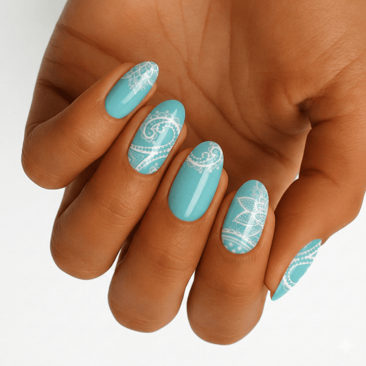 Turquoise nail wraps with white mandala patterns on hand showing boho nail art