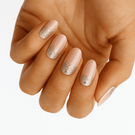 Rose gold glitter nail wraps with champagne shimmer on hand manicure