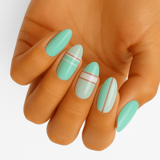 Mint green gel nail wraps with white stripes on hand showing minimalist nail art