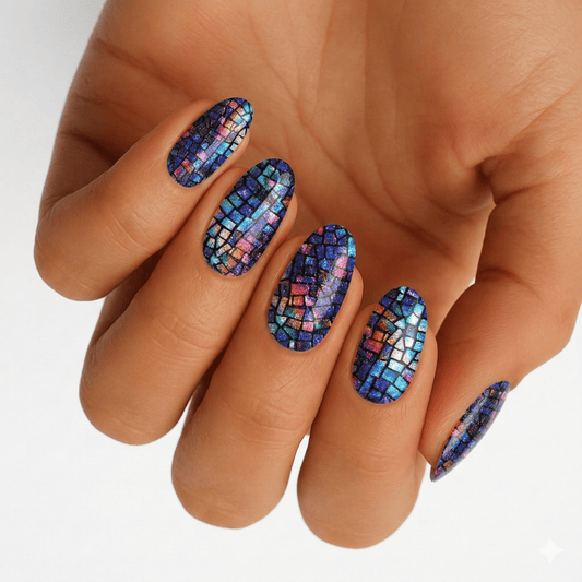 Blue holographic mosaic nail wraps on hand showing iridescent multicoloured pattern