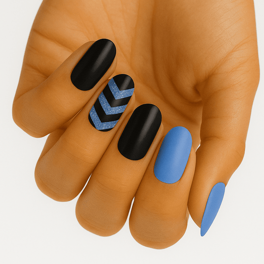 Black blue and silver chevron nail wraps on hand with matte geometric nail art