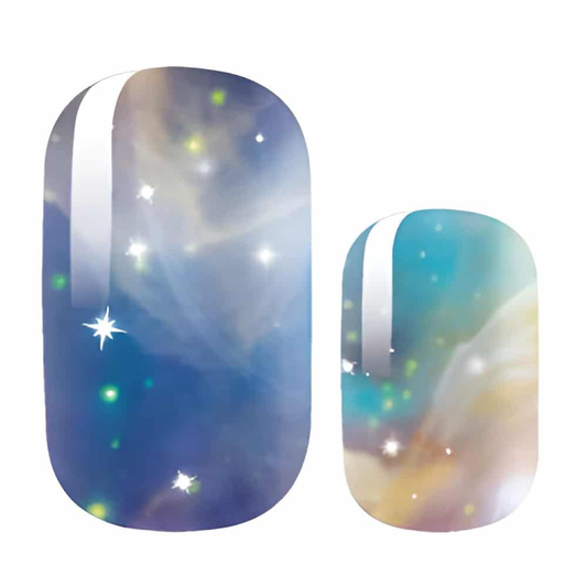 Blue cosmic nebula gel nail wraps with glittery starlight pattern for at-home manicures