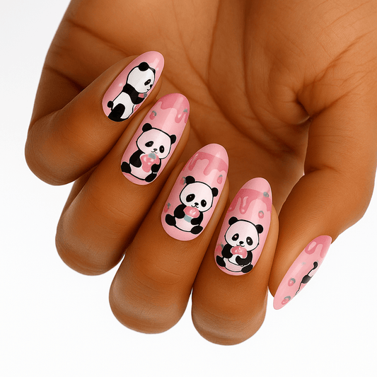 Pink nail wraps with cute black and white panda cartoon design on hand