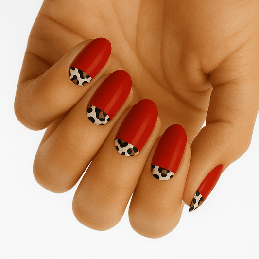 Red gel nail wraps with leopard print accent nails displayed on hand