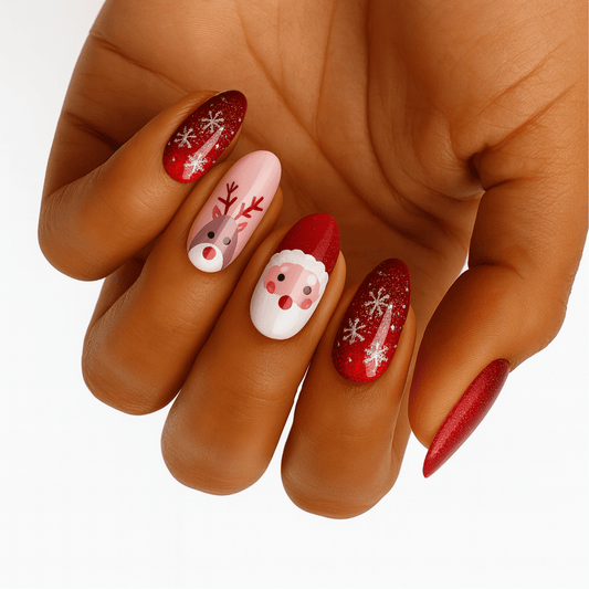 Hand showing red Christmas nail wraps with Santa and reindeer Rudolf snowflake designs