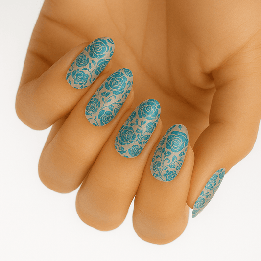 Teal blue floral rose pattern nail wraps applied on hand showing elegant vintage design