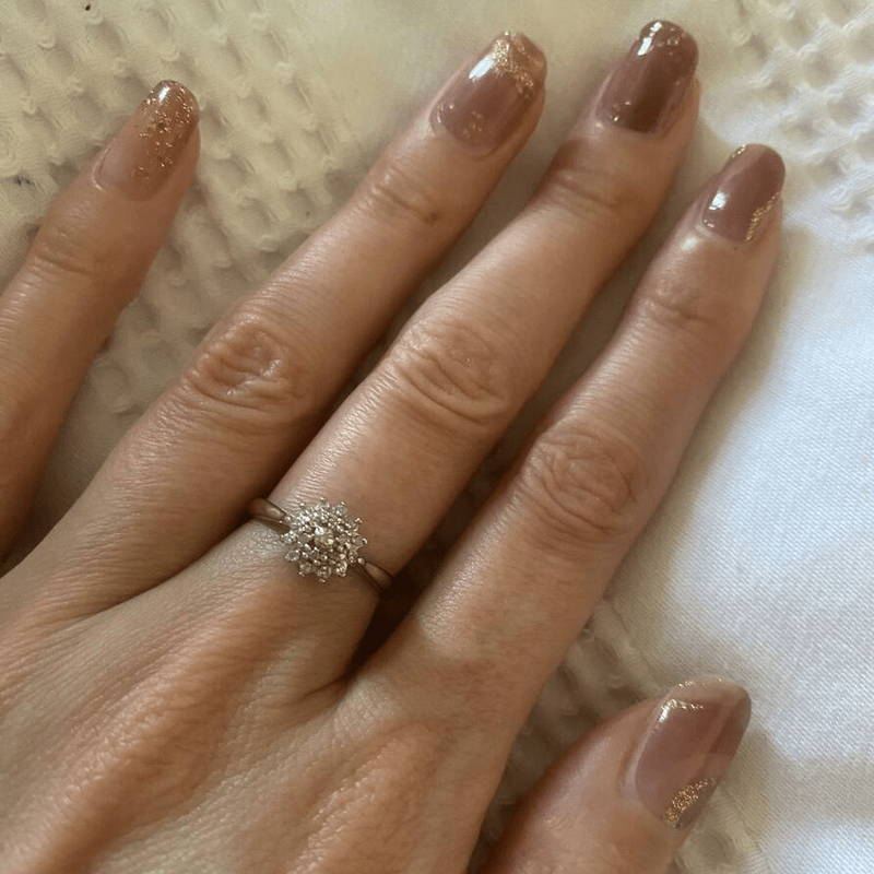 Dusty rose nail wraps with gold foil marble pattern on elegant manicure
