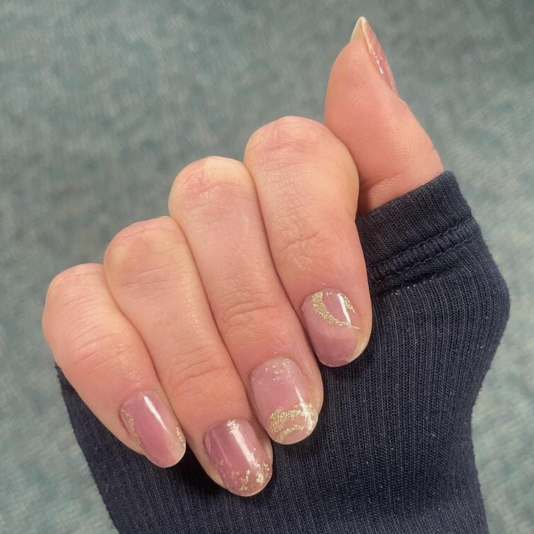 Pink stone marble nail wraps with rose gold foil on hand manicure