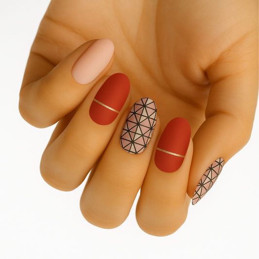 Red and nude nail wraps with geometric floral patterns on hand showing elegant manicure design