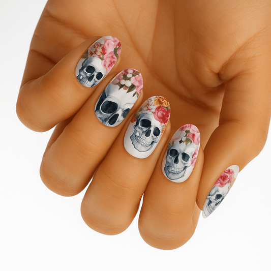 Gothic skull and roses nail wraps on hand showing floral skeleton design